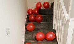 Stomping 25 red balloons up the stairs