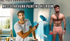 Muscular hunk painting his room