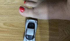 Giantess feet playing with car