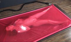 Masturbation in a pink latex vacuum bed
