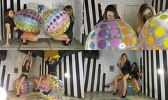 Nastya and Lucy on huge beach balls