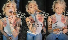 Smoking and inhaling cigar in Denim jeans and Silver top - Kinkerbell23