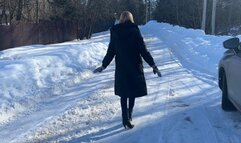 girl in leather boots walks on the ice and slips heavily, periodically falling