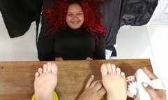 Ketty tickling soles in vertical clamps