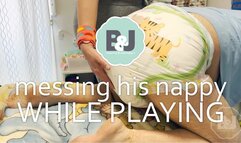 Messing his nappy while playing