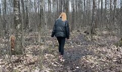 girl in high-heeled shoes and stockings walks first through puddles, then through mud, takes off her dirty shoes and tramples them into the ground