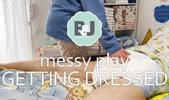 Messy play getting dressed
