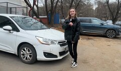 girl rocks the car suspension and the car shakes