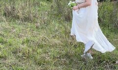 Bride sneaking up for a smoke break at her wedding - voyeur style capture