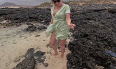 Desperate girl’s pee into the water outdoors